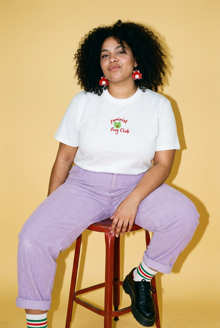 Frog tee styled with lilac trousers against butter yellow