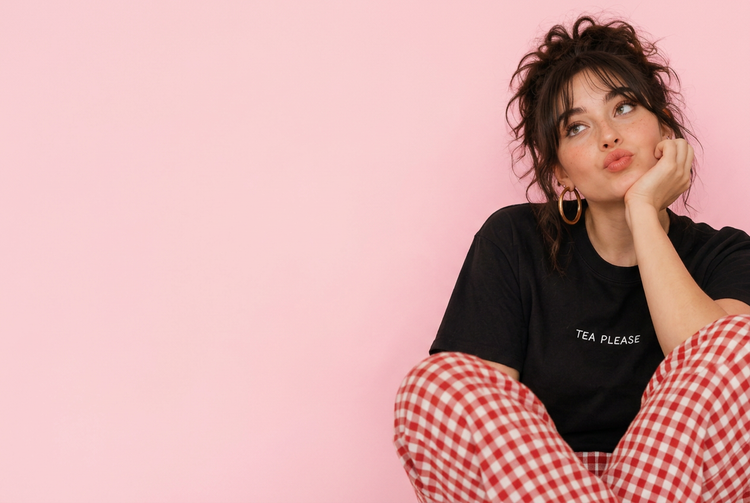 Model wearing the black Tea Please embroidered tee